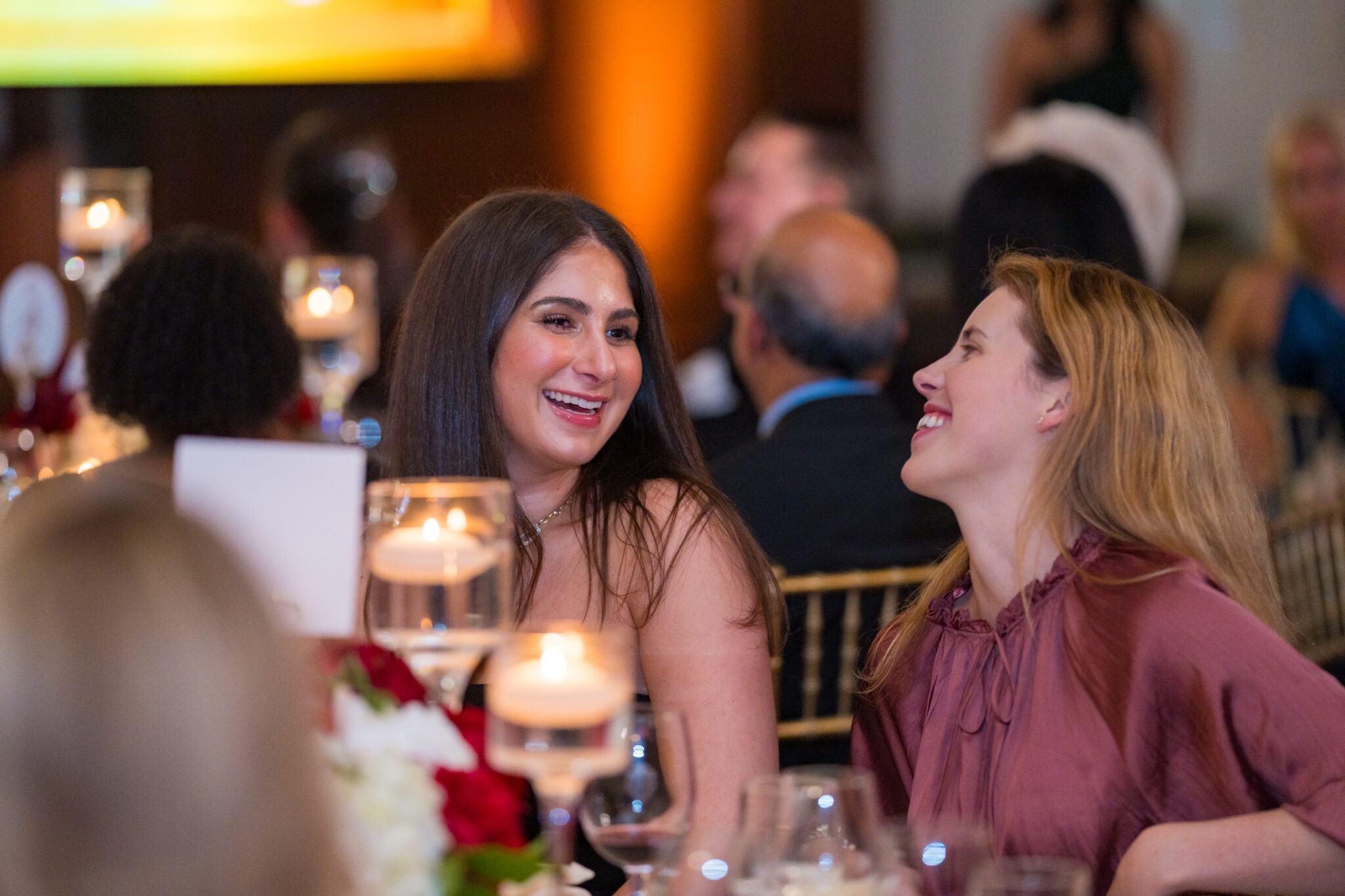 Guests sharing a laugh at dinner during the WLDA Awards Gala