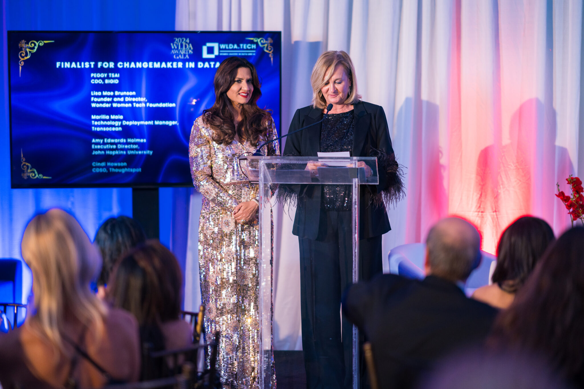 Presenters at the podium during the awards
